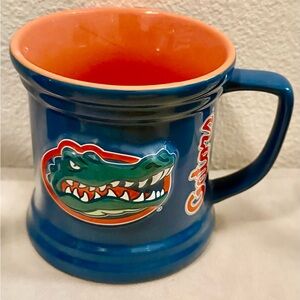 The Encore Group Gators Mug w/ relief gator.